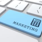 Marketing Concept. Marketing Word on Blue Computer Button